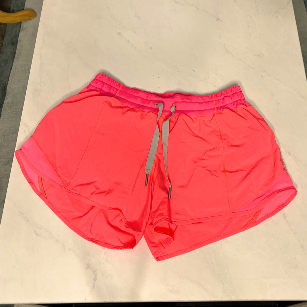 Orange Lululemon running short with elastic drawstring waistband size 8